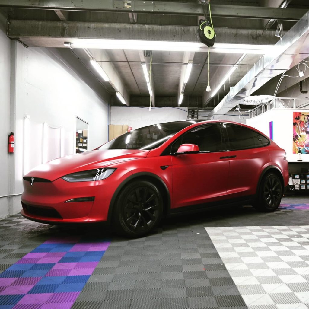 ppf and window tint on red tesla in Red Rocks Tint garage